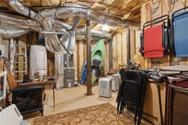 unfinished basement with heating unit and water heater