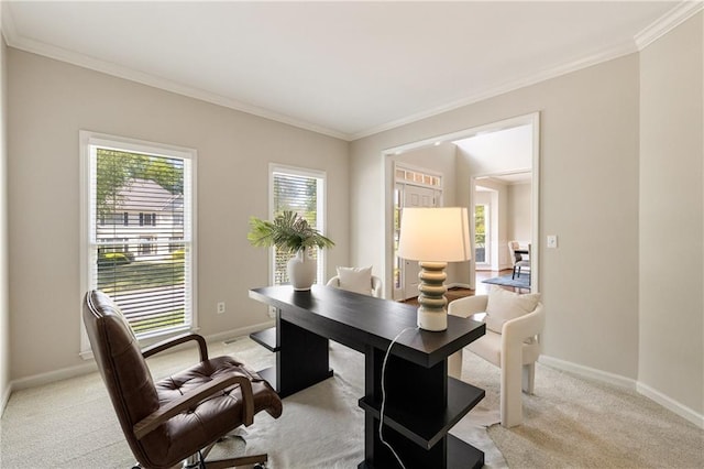 home office featuring light colored carpet, ornamental molding, and baseboards