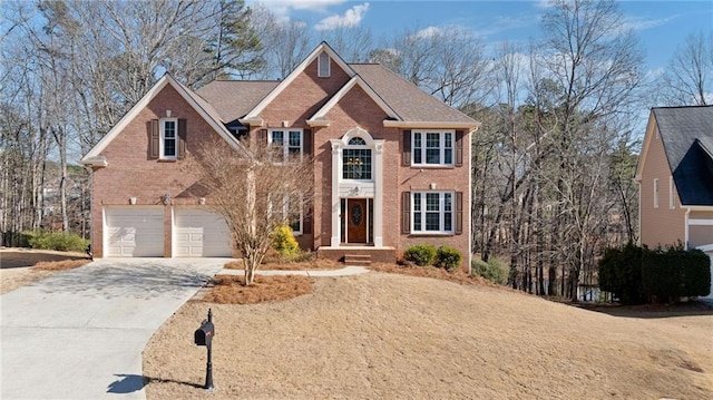 5073 Kingsbridge Pass, Powder Springs, GA 30127 - view of front of property featuring an attached garage, brick siding, and driveway