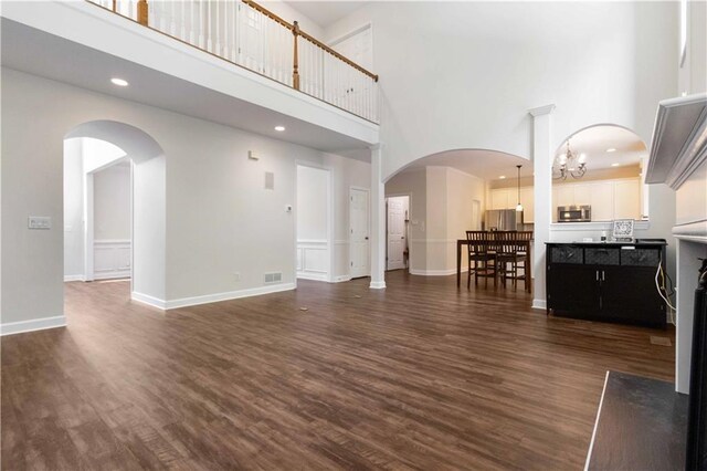 5073 Kingsbridge Pass, Powder Springs, GA 30127 - living area featuring baseboards, dark wood finished floors, a high ceiling, visible vents, and recessed lighting