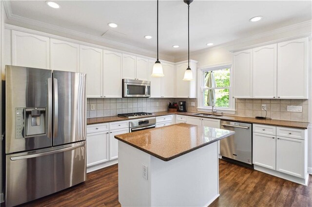 5073 Kingsbridge Pass, Powder Springs, GA 30127 - kitchen with ornamental molding, dark wood finished floors, white cabinetry, and stainless steel appliances