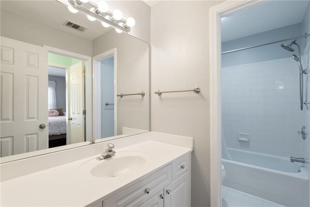 5073 Kingsbridge Pass, Powder Springs, GA 30127 - bathroom with visible vents, vanity, washtub / shower combination, and toilet