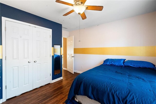 5073 Kingsbridge Pass, Powder Springs, GA 30127 - bedroom with a ceiling fan, baseboards, dark wood-type flooring, and a closet