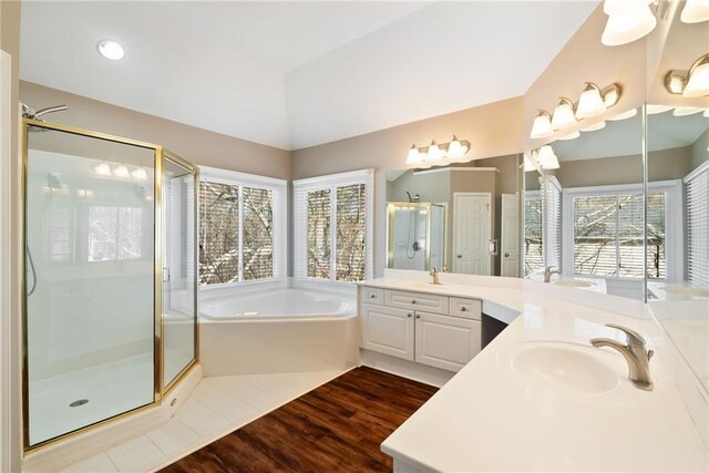 5073 Kingsbridge Pass, Powder Springs, GA 30127 - full bath with wood finished floors, a sink, two vanities, a garden tub, and a stall shower
