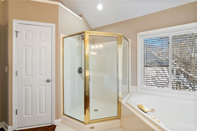 5073 Kingsbridge Pass, Powder Springs, GA 30127 - full bath featuring a bath, a shower stall, and lofted ceiling