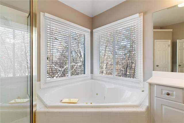 5073 Kingsbridge Pass, Powder Springs, GA 30127 - bathroom with an enclosed shower, vanity, and a jetted tub