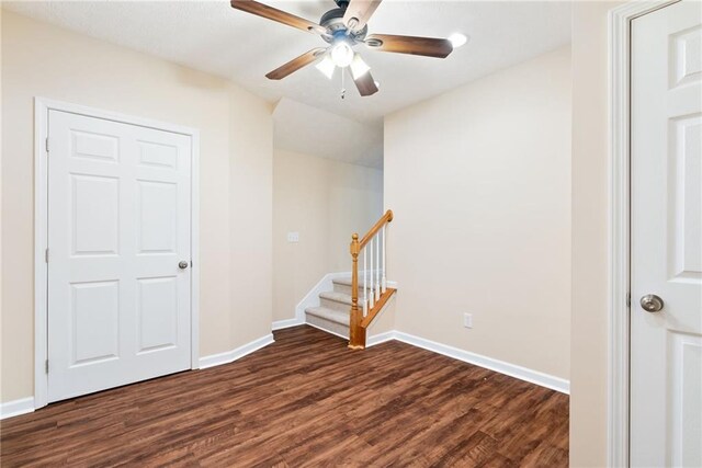 5073 Kingsbridge Pass, Powder Springs, GA 30127 - spare room with a ceiling fan, baseboards, stairs, and dark wood finished floors
