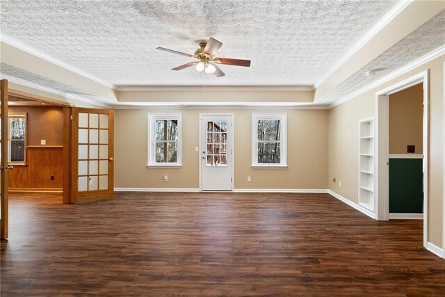 5073 Kingsbridge Pass, Powder Springs, GA 30127 - unfurnished room featuring dark wood-style floors, a tray ceiling, built in features, and ceiling fan