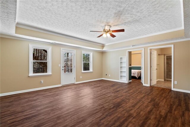 5073 Kingsbridge Pass, Powder Springs, GA 30127 - unfurnished bedroom featuring a tray ceiling, a textured ceiling, baseboards, crown molding, and dark wood-type flooring