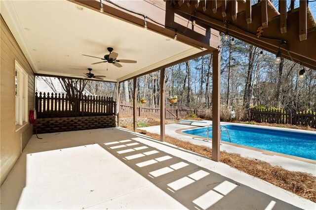 5073 Kingsbridge Pass, Powder Springs, GA 30127 - view of swimming pool with a fenced in pool, a fenced backyard, a ceiling fan, a diving board, and a patio