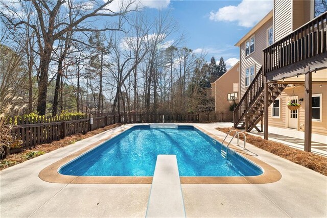 5073 Kingsbridge Pass, Powder Springs, GA 30127 - view of swimming pool with a fenced in pool, a fenced backyard, a patio area, stairs, and a diving board
