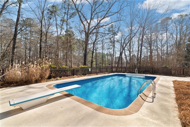 5073 Kingsbridge Pass, Powder Springs, GA 30127 - view of swimming pool with a fenced in pool, a patio area, a fenced backyard, and a diving board