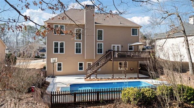 5073 Kingsbridge Pass, Powder Springs, GA 30127 - rear view of property with a fenced in pool, stairs, fence, a patio, and a deck