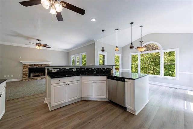 kitchen featuring white cabinets, dark countertops, a ceiling fan, and dishwasher