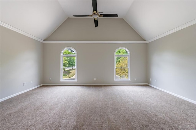 spare room with carpet, ceiling fan, lofted ceiling, and a healthy amount of sunlight