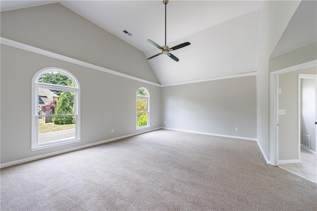 unfurnished room with high vaulted ceiling, a ceiling fan, visible vents, carpet, and baseboards