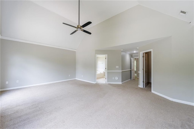 interior space featuring a ceiling fan, high vaulted ceiling, light carpet, and baseboards