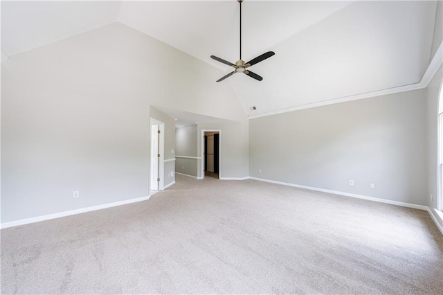 unfurnished living room with baseboards, high vaulted ceiling, ceiling fan, and carpet floors