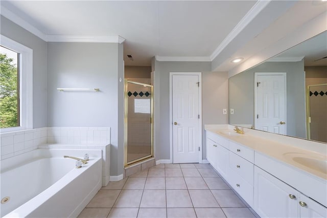 bathroom with a stall shower, double vanity, tile patterned flooring, and a bath