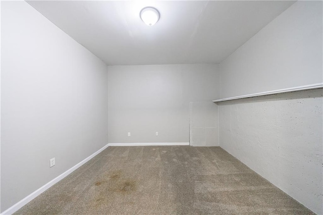 interior space with carpet and baseboards