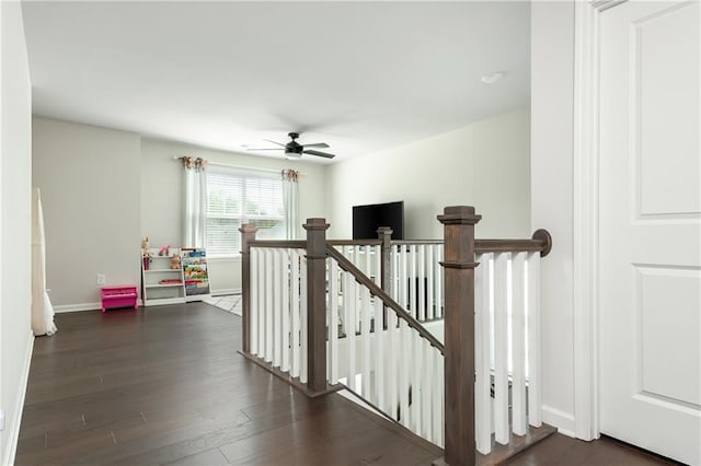 5025 Bryce Ln, Cumming, GA 30040 - hall with an upstairs landing, dark wood-type flooring, and baseboards