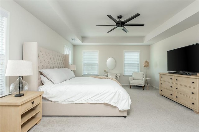 5025 Bryce Ln, Cumming, GA 30040 - bedroom with a tray ceiling, light colored carpet, a ceiling fan, and baseboards