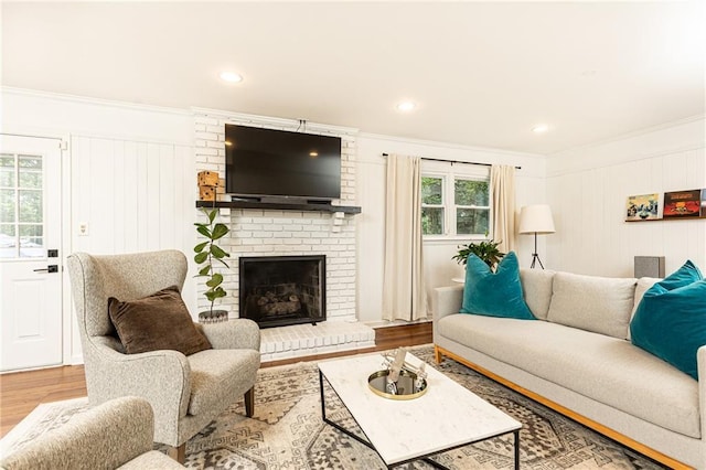 1329 W Nancy Creek Dr NE, Brookhaven, GA 30319 - living room with ornamental molding, wood finished floors, a fireplace, recessed lighting, and a decorative wall