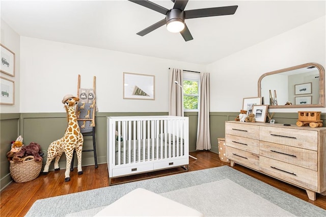 1329 W Nancy Creek Dr NE, Brookhaven, GA 30319 - bedroom featuring wood finished floors, wainscoting, and a ceiling fan