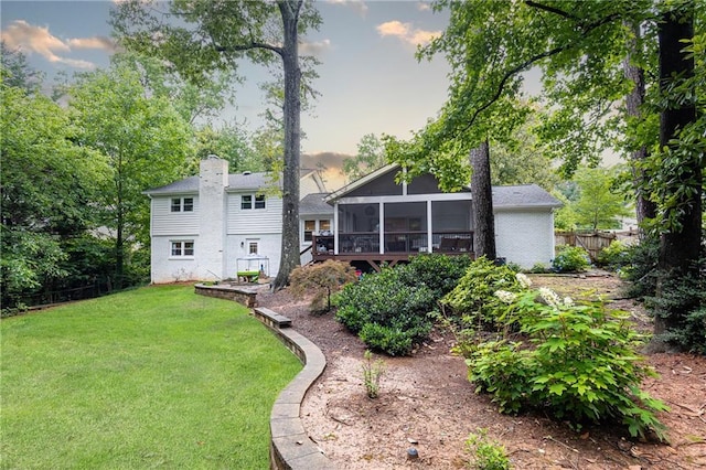 1329 W Nancy Creek Dr NE, Brookhaven, GA 30319 - back of property with a sunroom and a chimney