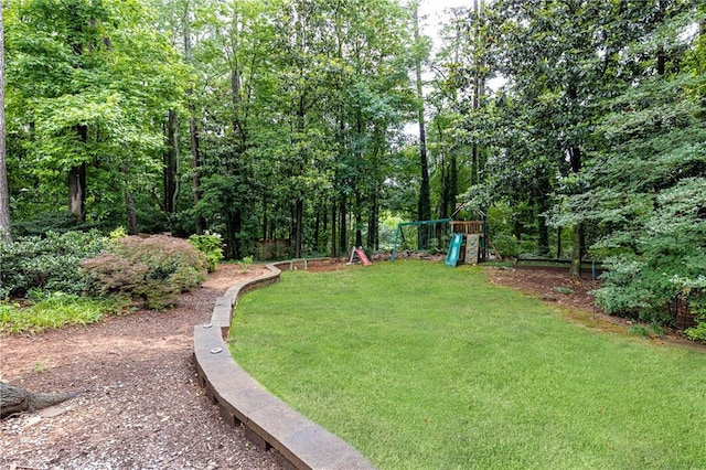 1329 W Nancy Creek Dr NE, Brookhaven, GA 30319 - view of grassy yard with a playground