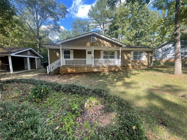 bungalow with a porch and a front yard
