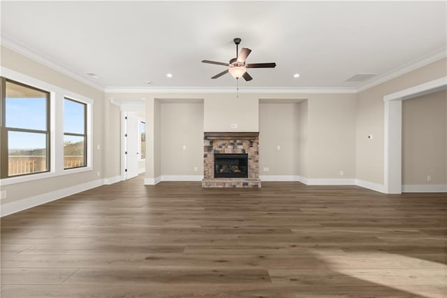 unfurnished living room with ceiling fan, dark hardwood / wood-style floors, crown molding, and a fireplace