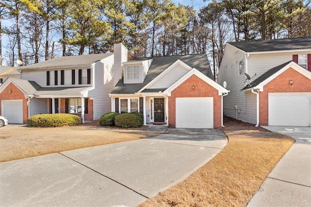 view of front property with a garage and a front yard