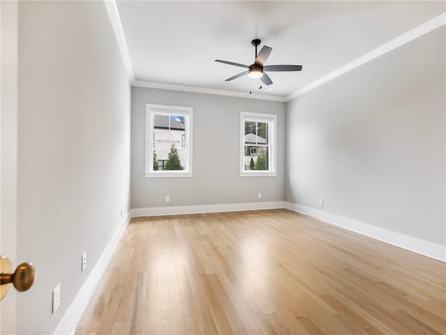 spare room featuring crown molding, ceiling fan, and light wood-type flooring