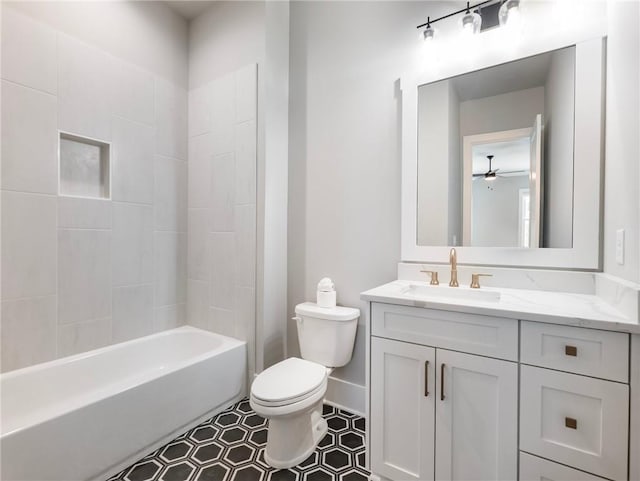 full bathroom featuring vanity, toilet, and  shower combination