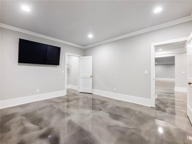 empty room with crown molding and concrete flooring