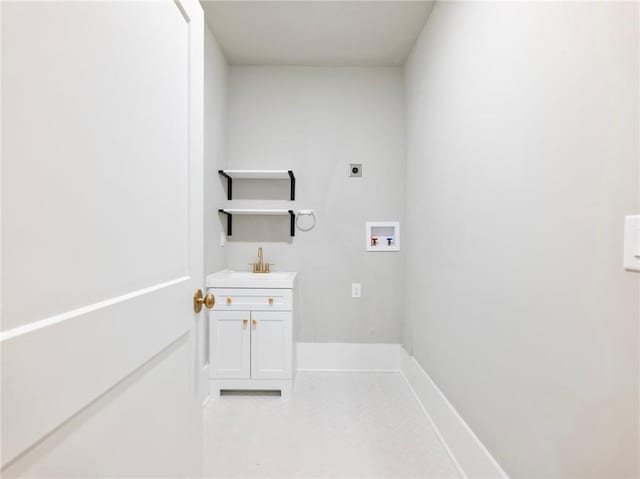 laundry room featuring sink, hookup for a washing machine, and hookup for an electric dryer