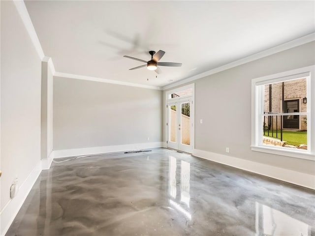 empty room featuring french doors, ceiling fan, ornamental molding, and concrete flooring