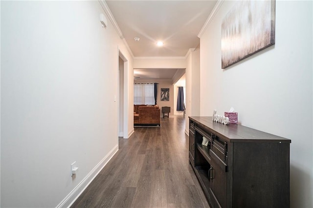 hall with crown molding and dark hardwood / wood-style flooring