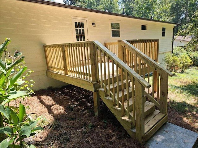 wooden deck featuring stairs