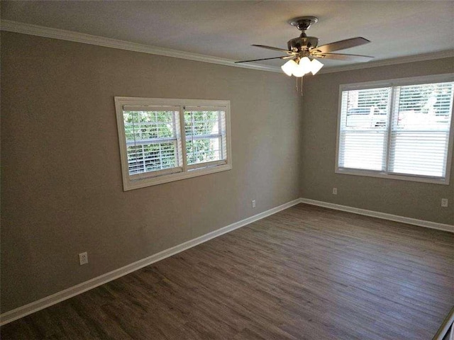 spare room featuring ceiling fan, dark wood finished floors, baseboards, and ornamental molding