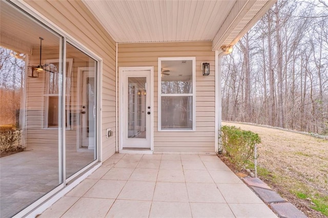 entrance to property featuring a patio