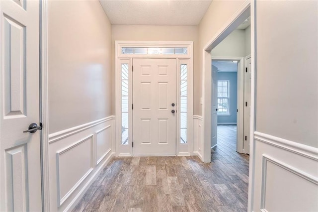 entrance foyer featuring hardwood / wood-style floors