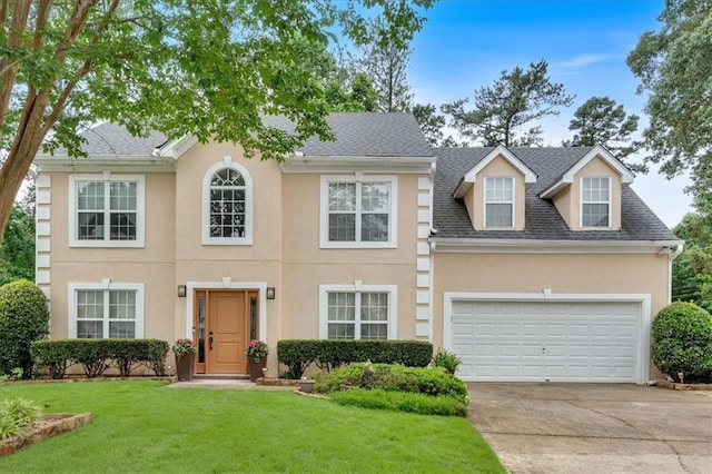 3573 Willow Tree Trce, Decatur, GA 30034 - view of front of home with concrete driveway, stucco siding, a front yard, roof with shingles, and a garage