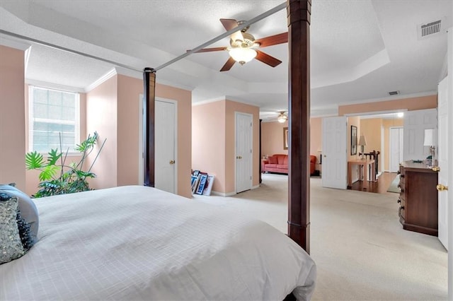 3573 Willow Tree Trce, Decatur, GA 30034 - carpeted bedroom featuring a tray ceiling, crown molding, and a ceiling fan