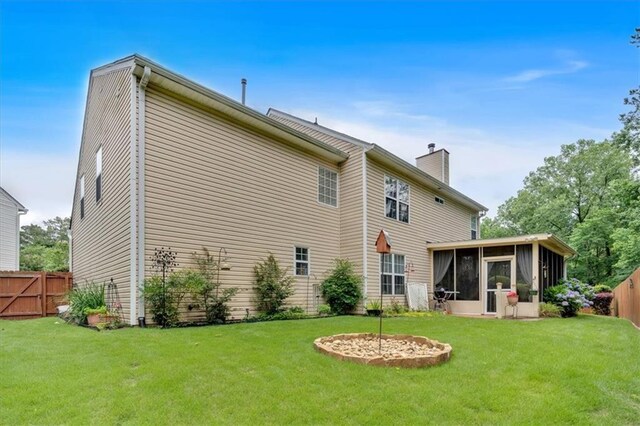 3573 Willow Tree Trce, Decatur, GA 30034 - rear view of house featuring a chimney and a sunroom
