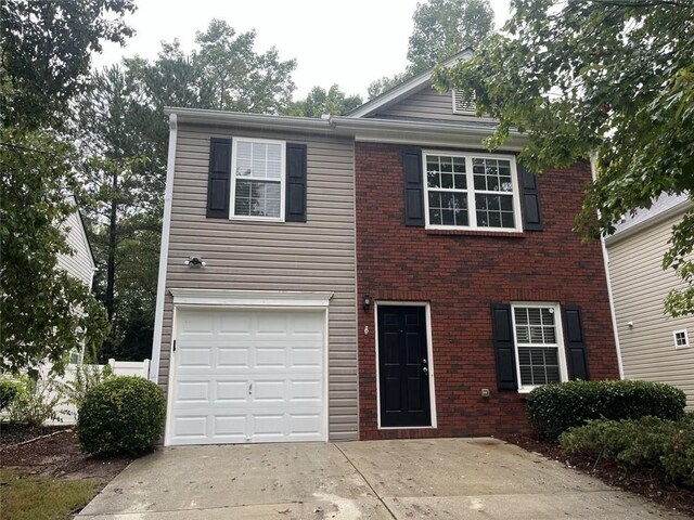 view of front of property featuring a garage