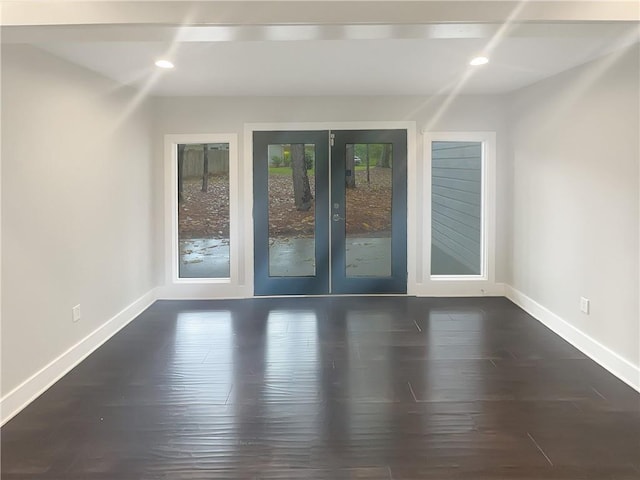 unfurnished room featuring french doors