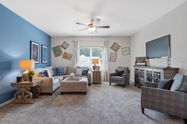 carpeted living room featuring ceiling fan