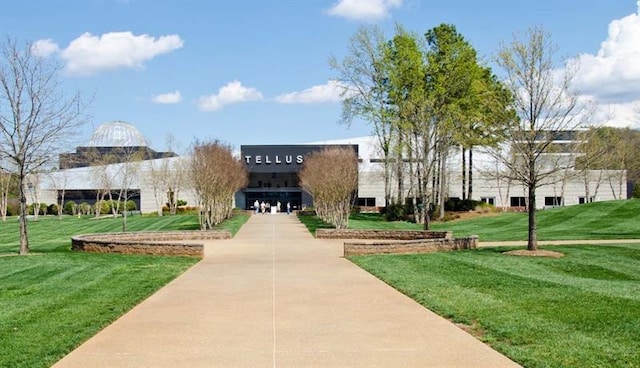 view of home's community featuring a lawn